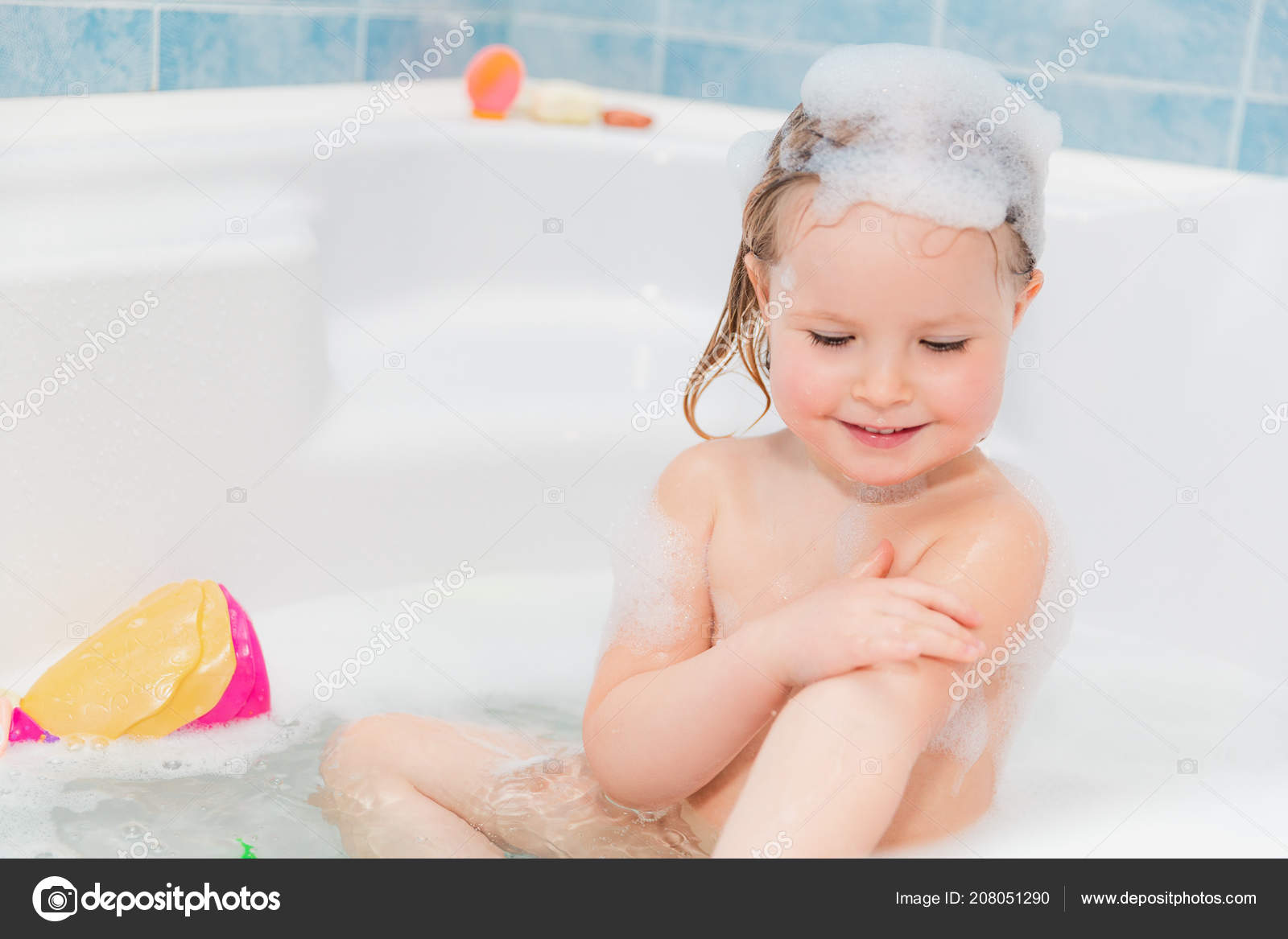 Litlle girl bathing ??? Stock Photo ?? capifrutta #208051290