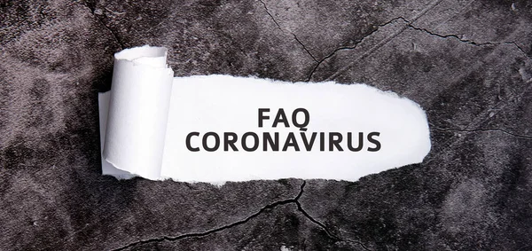 Faq Coronavirus Con Carta Bianca Strappata Tavolo Cemento Grigio — Foto Stock