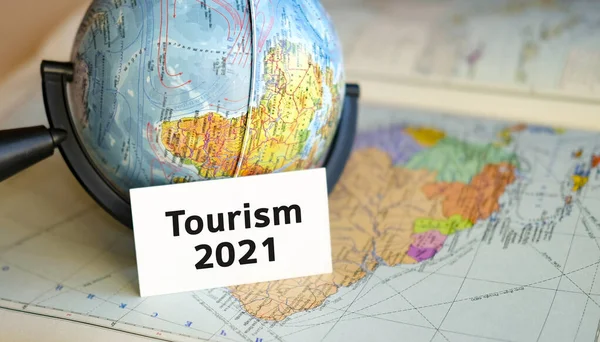 Travel Tourism 2021 Text White Sheet Globe Blue Background Atlas — Stock Photo, Image