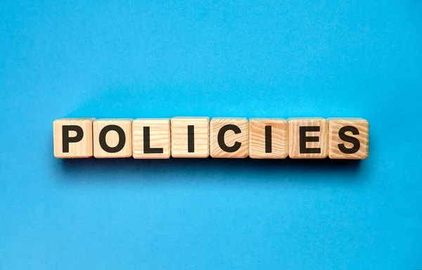 POLICIES word cube on a blue background. Medical concept. — Stock Photo, Image