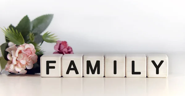 Family Text Wooden Cubes Floral Background Pink Tulips Green Plant — Stock Photo, Image