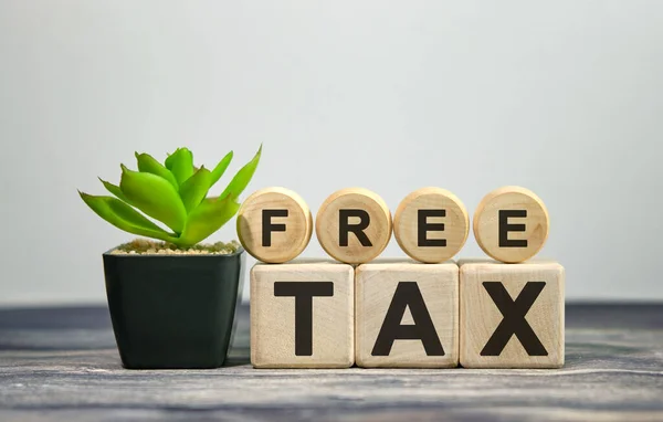 Free tax - Text on wooden cubes, on wight background