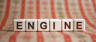 Motor - çizgili parlak arkaplanda tahta küpler üzerinde metin kavramı