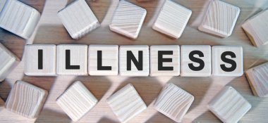 ILLNESS - metin ahşap küpleri ve etrafında bir sürü küp