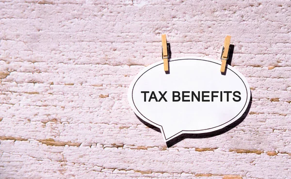 Tax Benefits White Sheet Wooden Pins — Stock Photo, Image