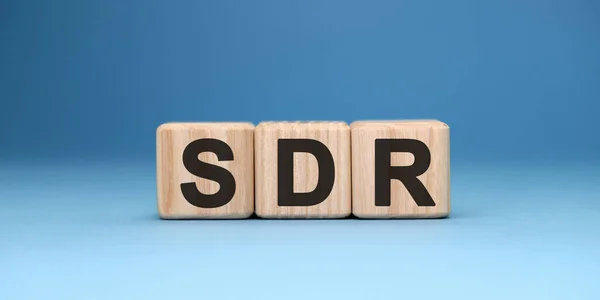 SDR - ahşap küplerin gradyan mavi arkaplan üzerine metin kavramı