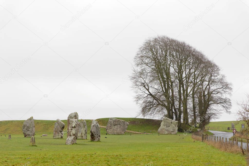 WILTSHIRE, GREAT BRITAIN - DEC 23, 2018: The stone monument Avebury Circle built in the late Neolithic period, around 2600 BC for unknown reason. December 23, 2018 in Wiltshire, Great Britain