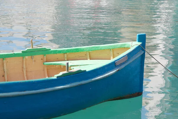 Close up of colorful blue and green traditional fishing boat in t — стоковое фото