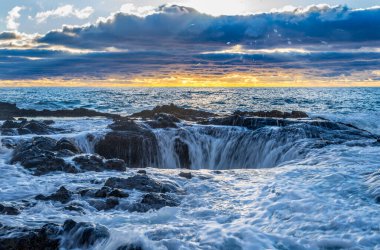 Dramatic sunset at Thor's Well | Cape Perpetua Scenic Area | Oregon clipart
