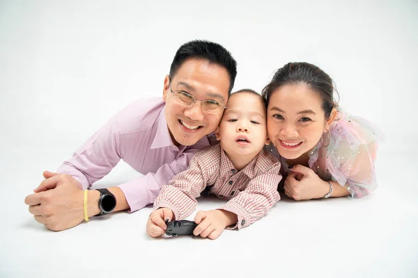 Thai-chinese  parent play toy with their son