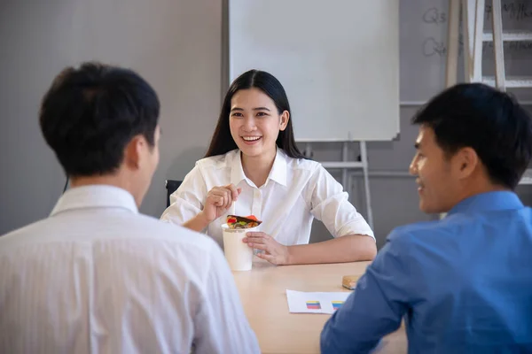 company colleague smile together on their lunch in office