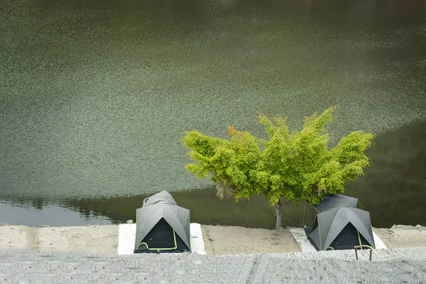 2 tent near the quite peace lake