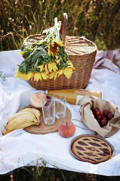 summer picnic. picnic basket, fruit, homemade pie