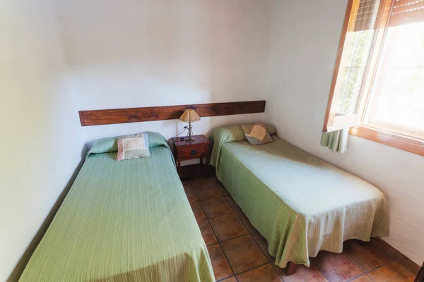 Bedroom inside an old-style rental cottage.