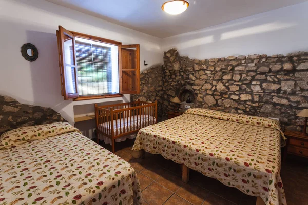 Bedroom inside an old-style rental cottage.