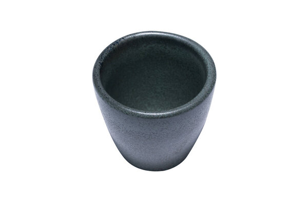 The small cup is gray-black, it is made of stone and has a beautiful texture pattern. Bangkok, Thailand.
