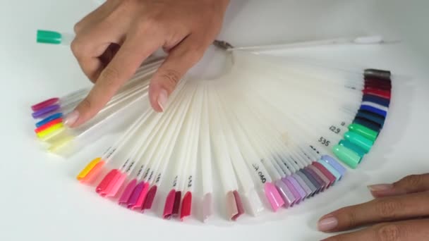 Woman Hands Holding Manicure Nail Color Samples Palette Beauty Health — Stock Video