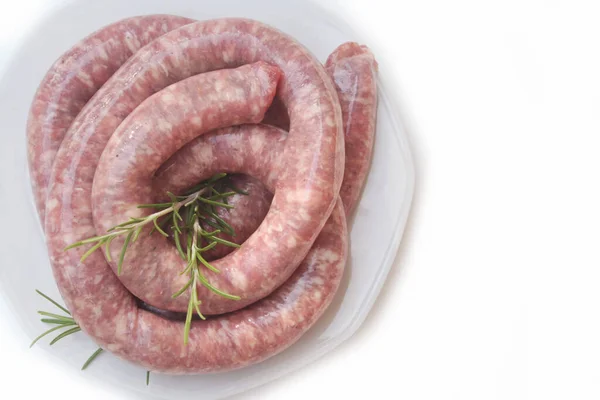 Raw Italian Long Pork Sausage Fresh Rosemary Branch Plate White — Stock Photo, Image
