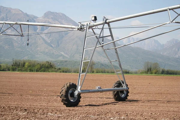 Industrial irrigation system on a field. Agricultural landscape in springtime