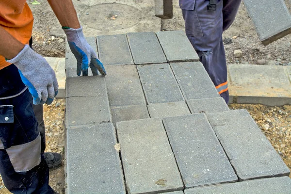 Master Laying New Concrete Bricks Sidewalk Pile Bricks Have Been — Stock Photo, Image