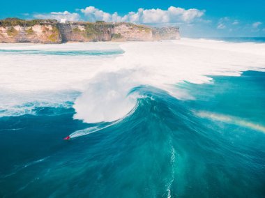 Aerial shooting of big wave surfing in Bali. Big waves in ocean clipart