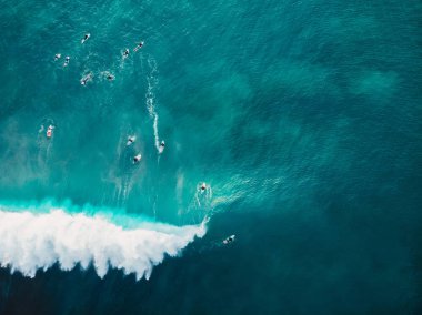 Aerial shooting of big wave surfing in Bali. Big waves in ocean clipart