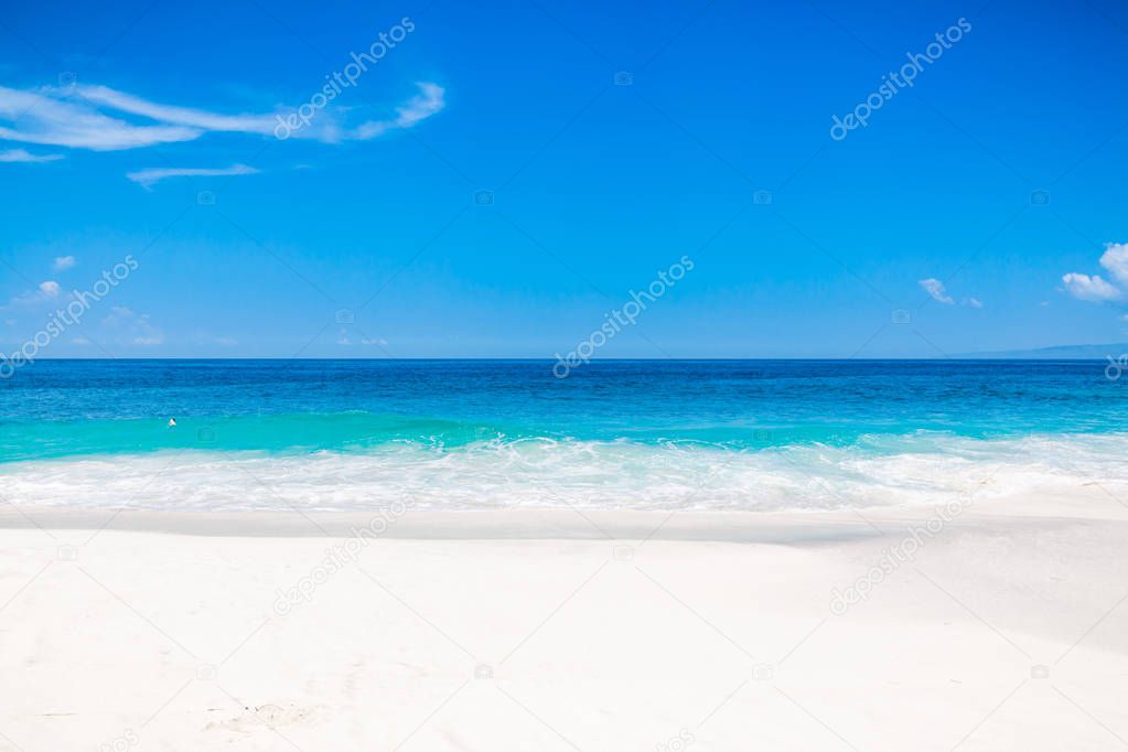 Tropical white beach with blue ocean in tropical island