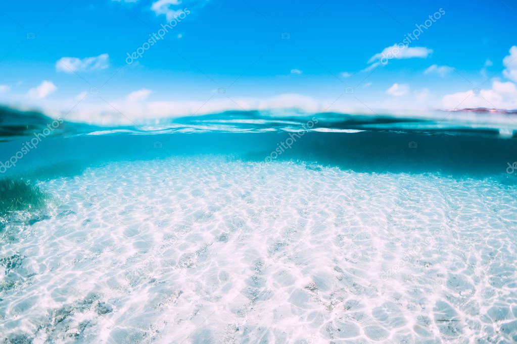 Tropical ocean in underwater. Blue water and white sand in paradise island
