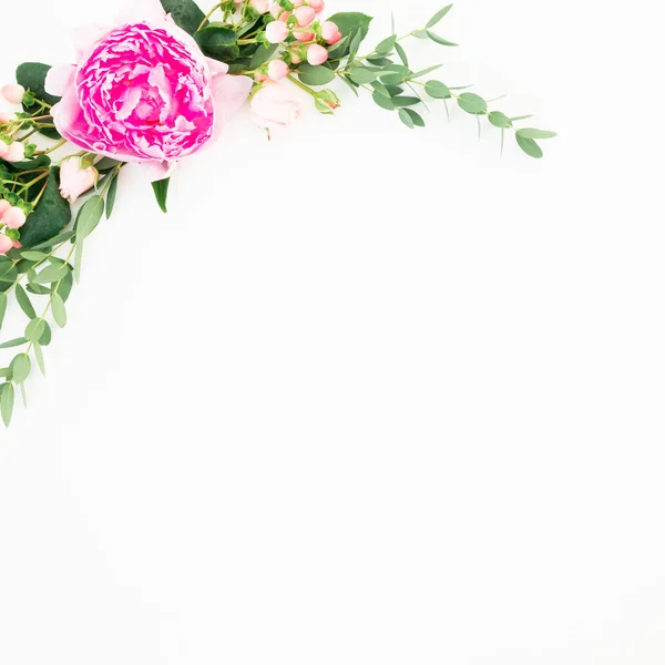 Floral frame with peonies and roses flowers and eucalyptus on white background. Flat lay, top view