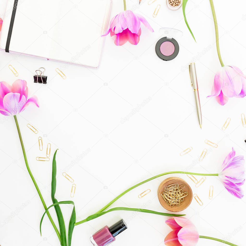 Concept with clipboard, notebook, pen, pink tulip flowers and cosmetics on white background. Flat lay