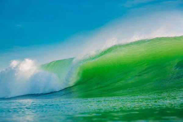 Big green wave in ocean. Breaking wave in Bali