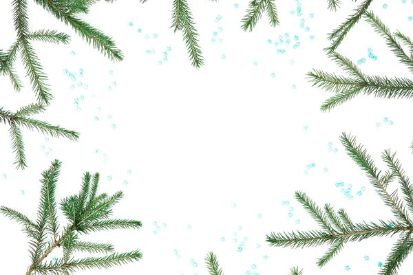 Christmas frame of fir branches with blue snowflakes on white ba — Stock Photo, Image