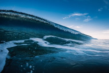 Blue barrel wave in ocean. Breaking sea wave clipart
