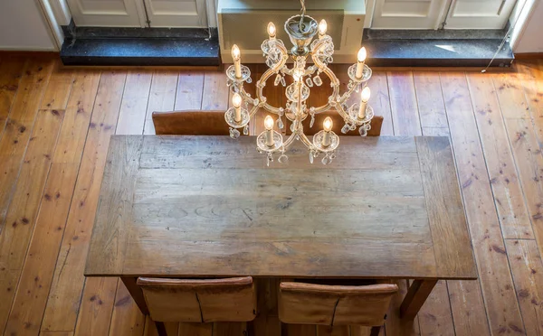 luxurious dining room with chandelier and wooden table