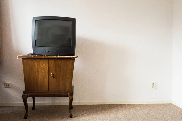 Vintage Television on wooden antique closet, old design — Stock Photo, Image