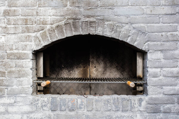 Traditional used stone oven close-up grey bricks