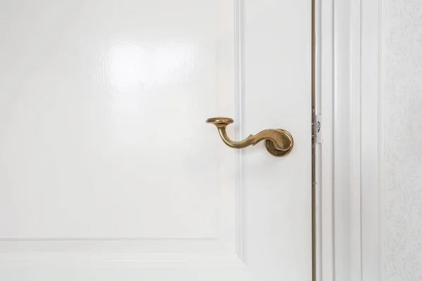 Wooden white door, with gold door handle close-up — Stock Photo, Image
