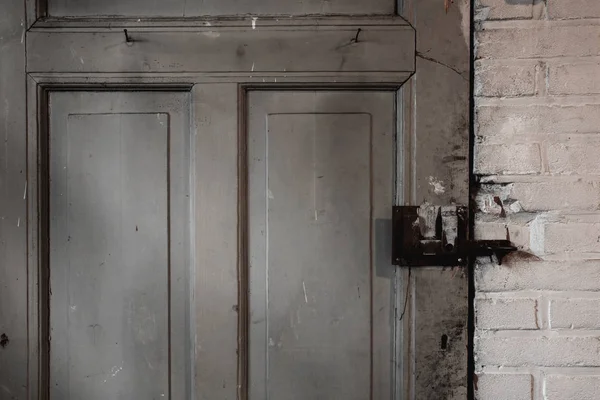 Old dirty wooden door industrial building dirty, close-up background texture — Stock Photo, Image