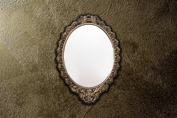 antique mirror on gold wall background texture, vintage design