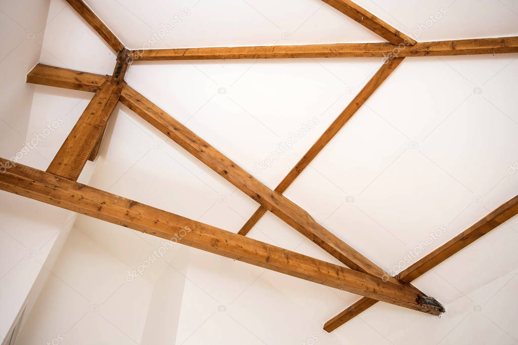 Wooden design. Wooden beams to ceiling as a design element. Modern interior.