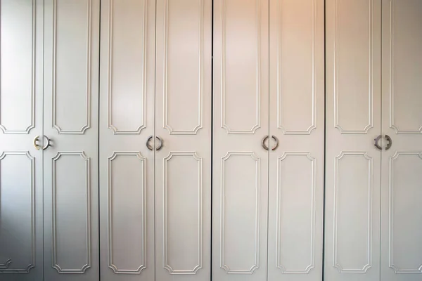 White luxury closet doors wood closeup, modern design
