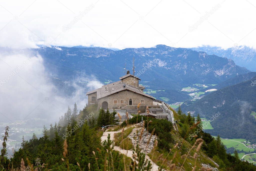 Kehlsteinhaus, Eagle Nest, Berchtesgaden in Germany, history place beautiful landscape on mountain peak with mist, cloudy background