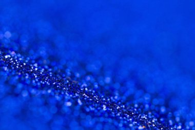 Mavi glitter doku makroyu kapatın. Soyut ışıltı arka plan.