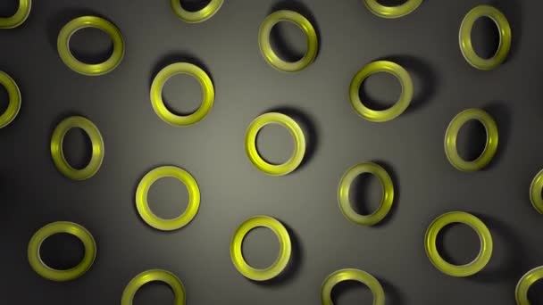 黄色玻璃圆环在黑暗的表面旋转 抽象创意4K 无缝循环动画 — 图库视频影像