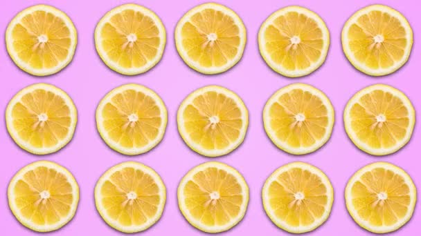 Animation abstraite de couleur de citron tranché sur fond pastel violet. Coutures 4K — Video