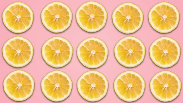 Abstract color animation of sliced lemon on pink pastel background. 4K seamless loop clip art fruit footage. — Stock Footage Abstract color animation of sliced lemon on pink pastel background. 4K seamless loop clip art fruit footage. Stock Video