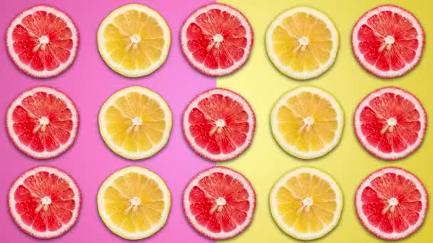 Animación de color violeta y amarillo abstracto de limón en rodajas y pomelo en pas — Vídeos de Stock