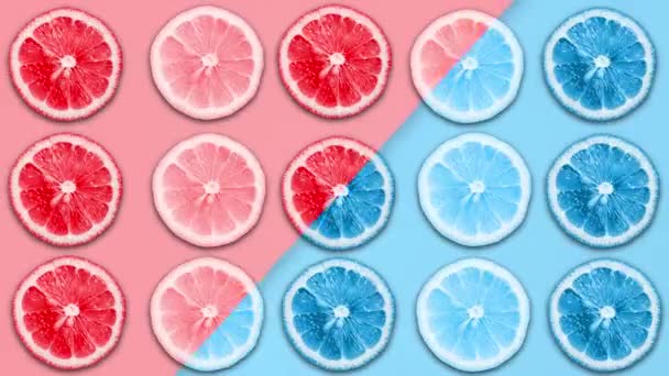 Abstrakte Farb-Animation von Zitronen- und Grapefruitscheiben auf unterschiedlichem Pastell-Rücken — Stockvideo