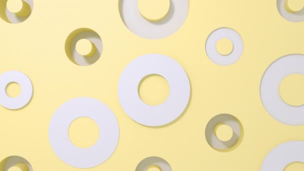 白色的圆形3D在黄色的彩绘背景下塑造几何动画。 4k循环渲染镜头. — 图库视频影像