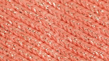 Pembe pastel kumaş dönen. 4k makro görüntüleri.